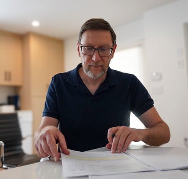 Stephen blajberg north vancouver mortgage broker works on filing paper work for clients