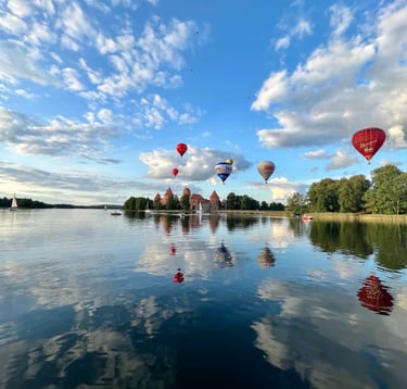 hot air balloons over Trakai