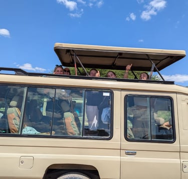 Tourists exploring Tarangire National Park in a safari vehicle on a Tanzania wildlife tour.