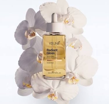 Add instant shine and smoothness with Keune Radiant Gloss Oil, available at BB Hair Art Salon. This