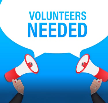 Comic style image of two hands holding megaphones with the text volunteers needed
