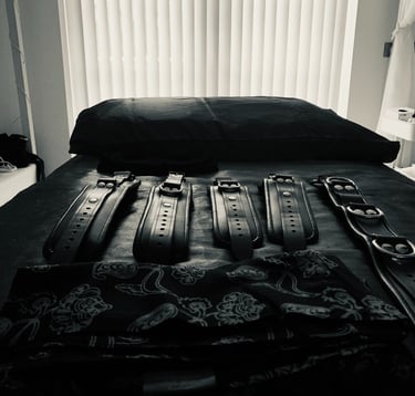 Teal Revel's BDSM massage table with leather cuffs 