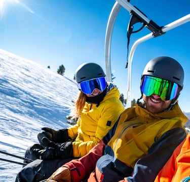 Enjoying a private ski lesson experience with friends in the mountains