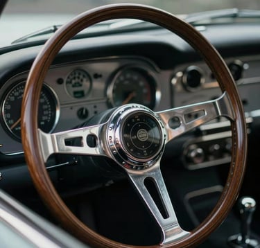 A close-up, macro shot of a vintage automobile's wooden steering wheel and polished chrome dashboard gauges. The focus is on the intricate textures and craftsmanship. Lighting is moody and directional, with subtle hints of #5D6D7E in the reflections. The overall aesthetic is premium and exclusive.