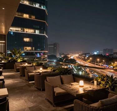 The luxurious rooftop lounge of a high-rise building in Noida at night. Elegant outdoor furniture, ambient warm lighting, and a panoramic view of the twinkling lights of the Greater Noida Expressway. Sophisticated South Asian / Indian urban lifestyle setting, professional architectural photography.