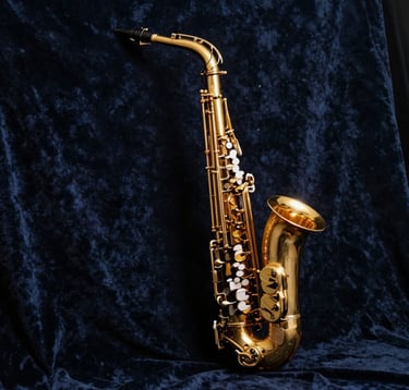 A minimalist, artistic shot of a golden saxophone resting against a dark navy velvet backdrop, illuminated by a single spotlight, evoking a sense of premium luxury and high-end media production.