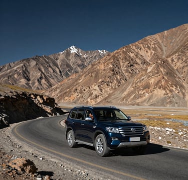 A premium dark navy SUV navigating a sharp bend on a high-altitude road in Ladakh. The dramatic brown mountains contrast with the Deep Navy sky. South Asian / Indian travelers inside are visible, highlighting the professional car rental service and the rugged beauty of the region.