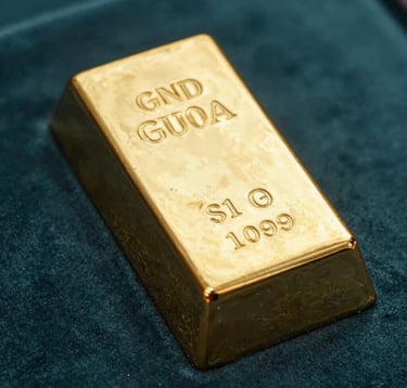 A close-up photograph of a highly polished 1kg gold bullion bar with refined engravings, resting on a dark teal velvet surface. Soft, professional studio lighting emphasizes the lustrous gold texture and the sharp, professional quality of the metal.