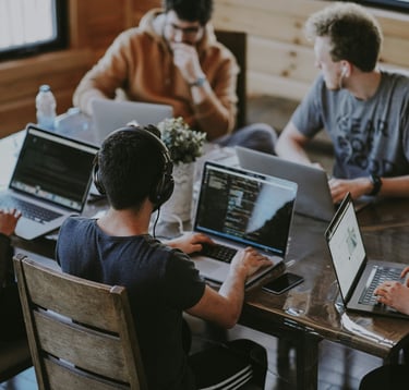 a team using their laptops to work