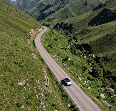 An aerial view of a winding road through a lush green valley with a clean, modern vehicle traveling along it, bright daylight, North American landscape, high-quality travel photography focusing on ease and adventure.