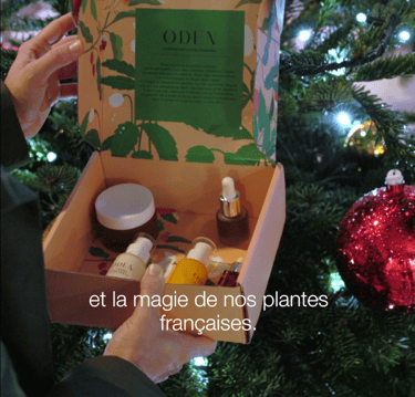 a person holding a box with a box of cosmetics