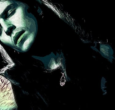 A handsome, long-haired, tattooed man in green and black hues