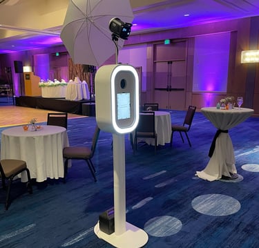 a table with a white umbrella and a white umbrella