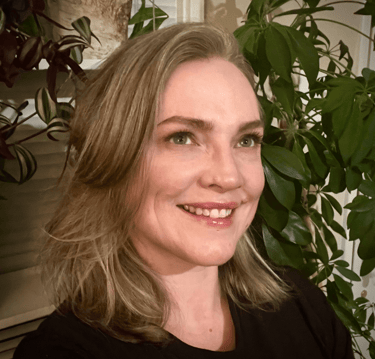Missy Berens, headshot of a woman with blonde hair and a black shirt