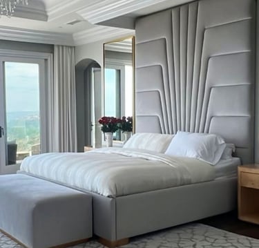 Tall sculpted headboard bed in light gray fabric, custom-designed by Solo Home Decor for luxury interiors.