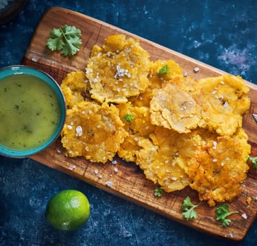 a board with tostones and mojo boricua