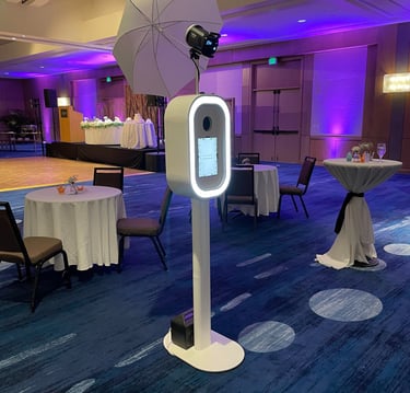 a table with a white umbrella and a white umbrella