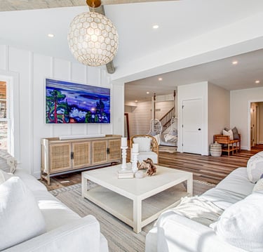 a living room with a television and a flat screen tv