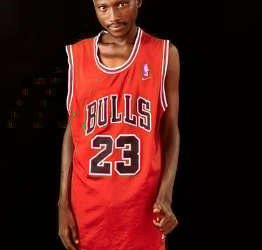 a man in a red jersey with a basketball jersey on