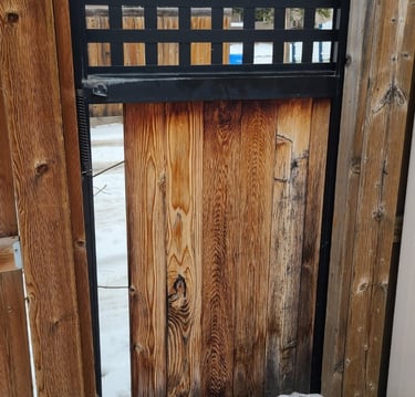 Fence gate with broken fence board under construction 