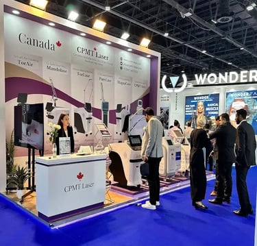 High-tech custom stand for CPMT Laser Canada with modern blue LED under-lighting and product presentation zones.