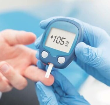 A healthcare professional in blue gloves uses a glucose meter to check a patient's blood sugar levels.