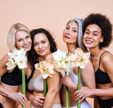 a group of women in bikinis posing for a photo
