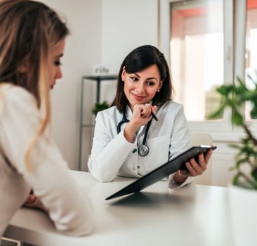 a female doctor in a white coat and a stethoscoped steth
