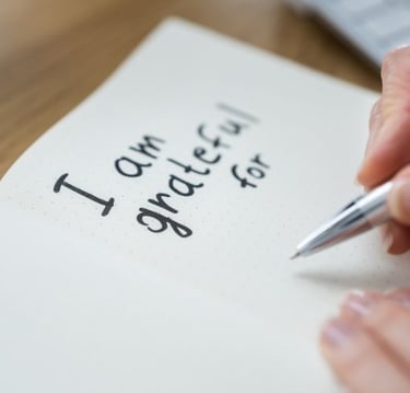 a person writing a notepad with a pen