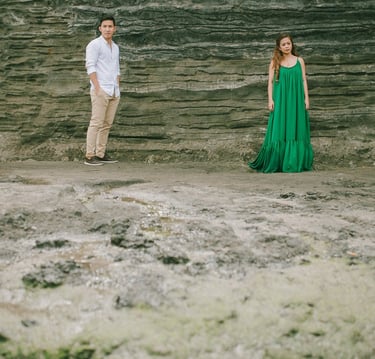 Intimate couple portrait with Tanah Lot temple in the background during a Bali photography session.