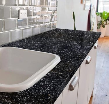 Modern kitchen black granite-look countertop — DIY upgrade, sleek black finish.