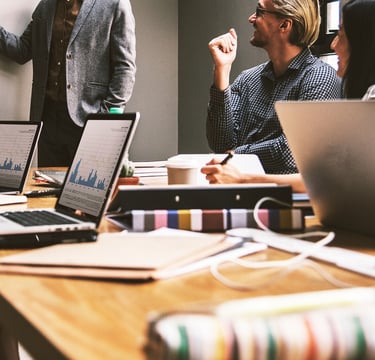 group of people in a business meeting representing gold ira for small businesses