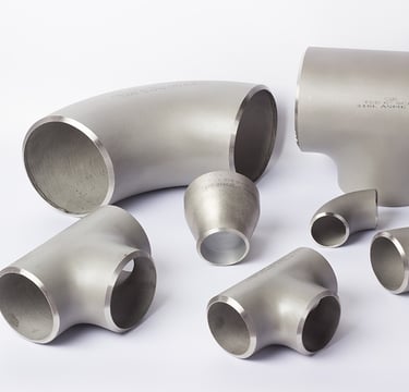 Assorted 316L stainless steel pipe fittings including elbows, tees, and reducers on a white background.