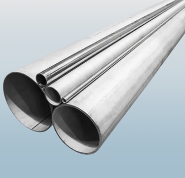 Industrial round stainless steel pipes and metal tubing in various diameters for construction.