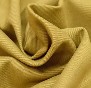 a close up of a tan colored fabric with a brown and white background