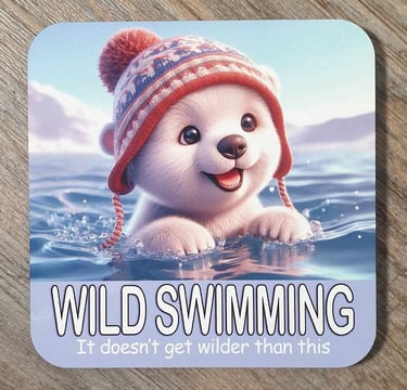 Wild swimming, fridge magnets, glass coasters, a polar bear swimming in the water with a hat on