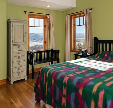 a bedroom with a bed and a dresser
