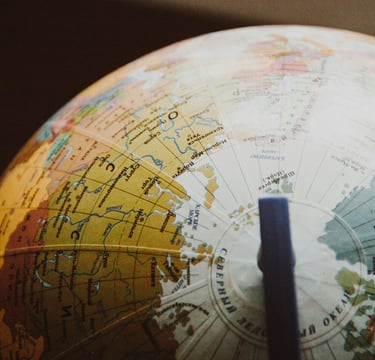 globe showing different countries and nations representing Gold IRA and geopolitical risk