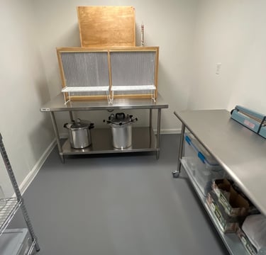 A sterile mushroom laboratory setup with a HEPA laminar flow hood on a stainless steel prep table.