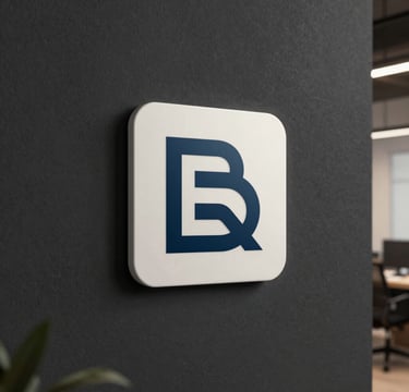 A sophisticated minimalist logo for a creative audiovisual studio, featuring clean lines in steel blue and off-white. The logo is displayed on a textured dark charcoal wall in a modern Latin American / Hispanic production office with soft ambient lighting.