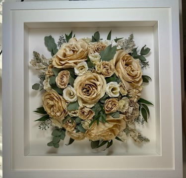 a Birdseye view preserved wedding bouquet in a frame