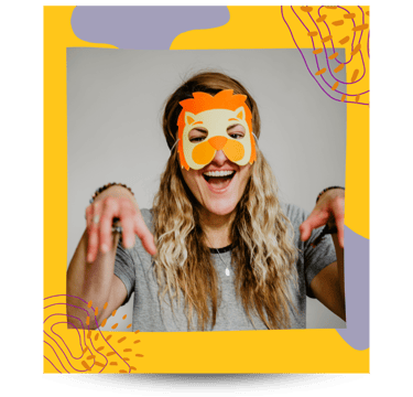 Martina wearing a lion's mask during kids yoga.