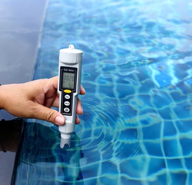 Digital water testing device checking pool chemical levels—part of Piscus Pools’ precise maintenance service.