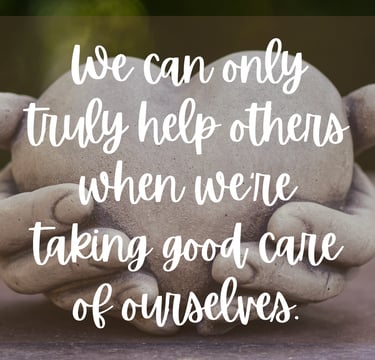 a stone statue of a person holding a heart