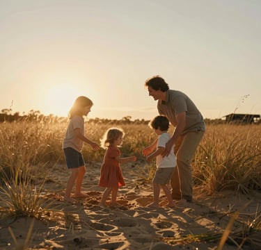Candid shot of a family playing in a golden-hour field in the US, sun flare through tall grass, warm sand and terracotta tones, cinematic depth of field, authentic laughter.