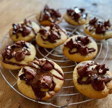 a bunch of cookies on a wire rack