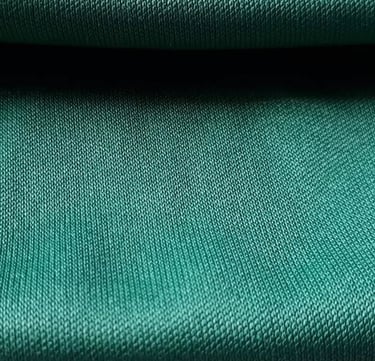 a close up of a green fabric covered fabric