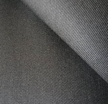 a close up of a black and white fabric with a black and white background