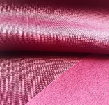 a close up of a pink fabric with a pink background