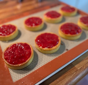 a baking tray with a tray of food and a cookie